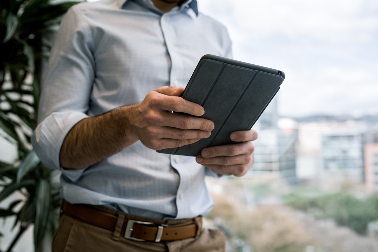 person holding an ipad
